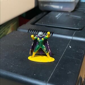 Heroic Action Figure with Purple and Yellow Cape